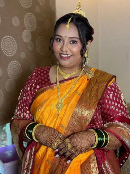 A complete look at the bride's traditional Maharashtrian wedding day style, from her makeup to her jewelry.