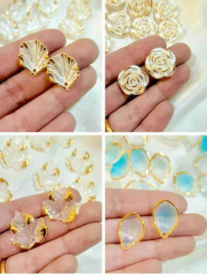 These decorative add-ons feature beautiful shell, rose, and leaf shapes with a pearlescent finish. They are perfect for creating elegant jewelry or embellishing photo frames.