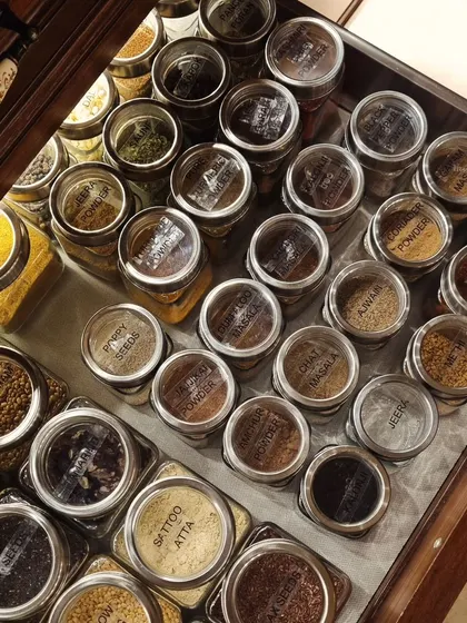 This perfectly organized spice drawer is what I call kitchen bliss. Using uniform jars with labels on top means you can find the exact masala you need in seconds.