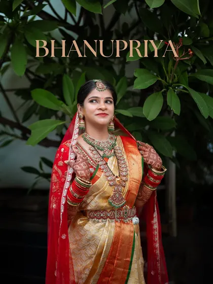 A graphic-style portrait of the bride, Bhanupriya, looking regal in her red and gold wedding saree.