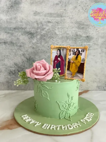 A lovely mint green cake with photo frames and a pink sugar rose, celebrating "Mota's" birthday.
