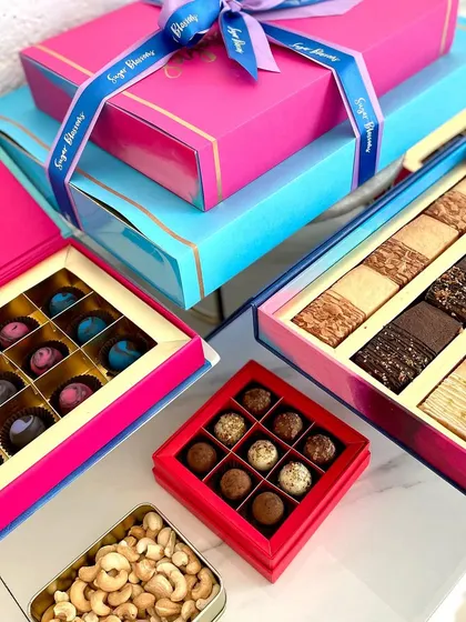 A selection of my Diwali gift boxes, showcasing the variety of treats you can choose from. You can mix and match shortbread cookies, bonbons, truffles, and savory nuts to create the perfect assortment.