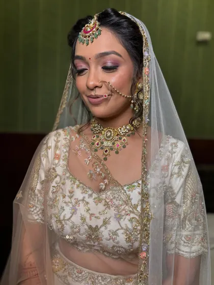 Another angle of this beautiful bride, her makeup looking perfect from every side.