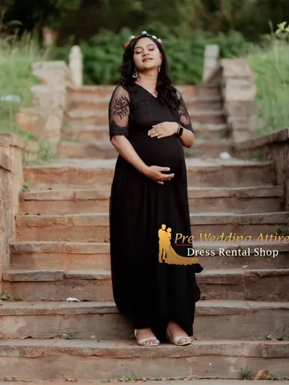 A peaceful and reflective portrait in the black flowy gown. The simple design and comfortable fit allow for natural and expressive poses, resulting in truly beautiful maternity photos.