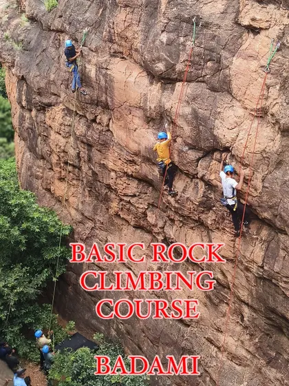 A promotional image showcasing multiple climbers on the red sandstone cliffs during our Basic Rock Climbing Course in Badami.