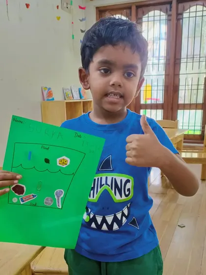 A big thumbs up for science! This camper is excited about his float and sink experiment results, a fun introduction to the concept of density.