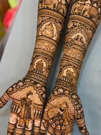 A classic full-coverage bridal design featuring the bride and groom in traditional wedding attire. The arms include auspicious symbols like Lord Ganesha, a kalash, and elephants.