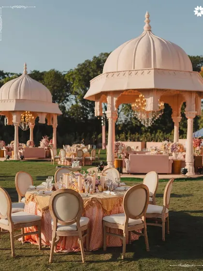 An outdoor seating arrangement at the Adani wedding, with gazebos creating intimate dining spaces. This showcases our approach to guest comfort, blending grand structures with smaller, personal areas for a more varied and enjoyable experience.