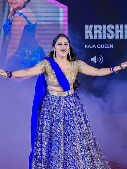 A joyful performer on stage, with her arms outstretched in a moment of expressive dance. We capture the peak emotional moments of any performance to deliver impactful photos.
