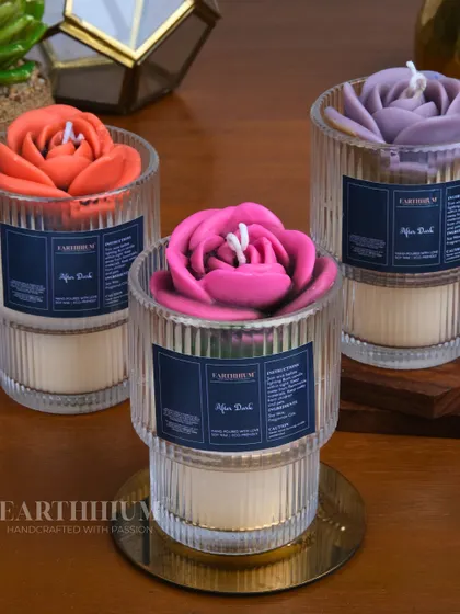 A trio of my 'After Dark' floral votive candles, showing the variety of vibrant colors available. They look stunning grouped together or as individual accent pieces.
