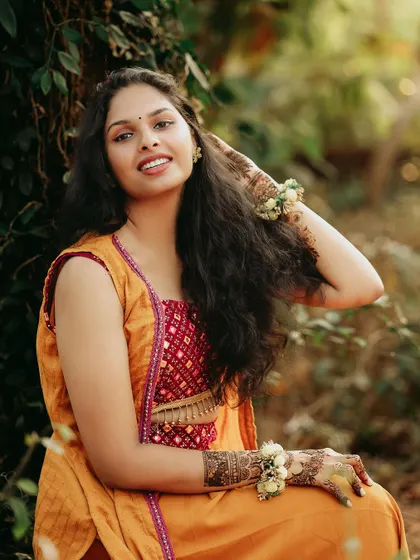 A candid and joyful portrait of the bride, her face lit up with a beautiful smile.