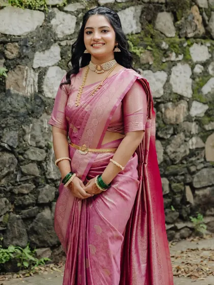A different engagement look in a pink silk saree, showcasing my ability to create varied looks for the same client.