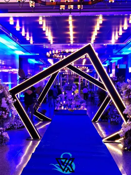 We love creating modern, high-impact designs for cocktail parties and corporate mixers. This geometric entrance tunnel, lit with a cool blue glow, provided a futuristic and exciting pathway for guests, setting a vibrant mood from the moment they arrived.