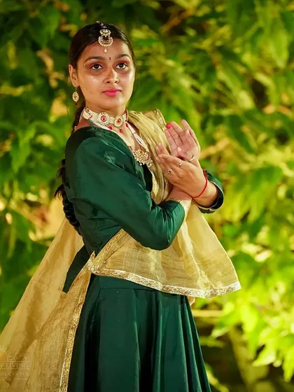 A classical dancer in a graceful pose during the Rajasthan Mahotsav. The festival is a platform for artists to share their talent and devotion through their craft.