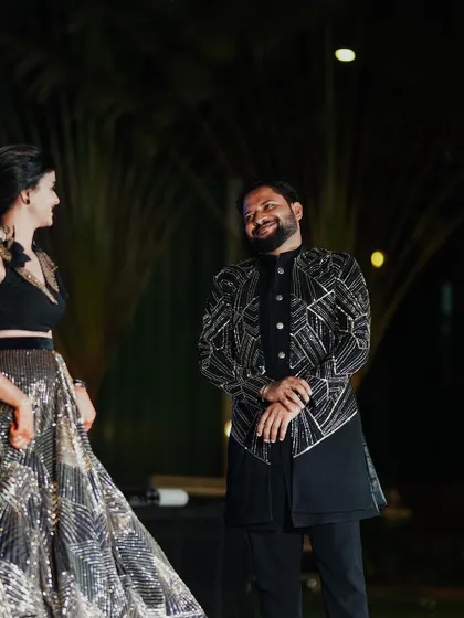 A candid moment of laughter between the bride and groom on the dance floor. We are always watching for these unscripted interactions that show a couple's true connection.