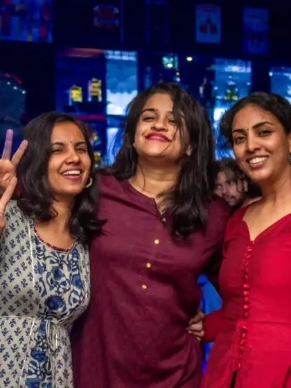 A happy group of friends enjoying the music and each other's company. The candid moments are often the best.
