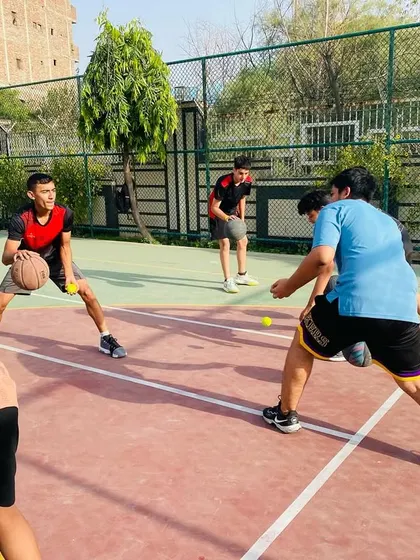A close-up of a player executing a crossover dribble during a skills session.