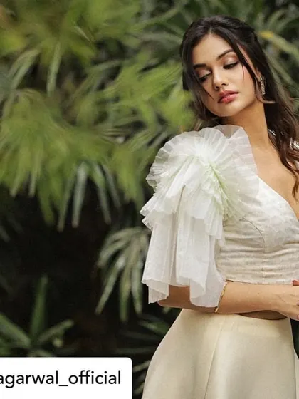 A full look at our contemporary white crop top, as worn by Divya Agarwal. It's a versatile piece that embodies our chic and modern design aesthetic.