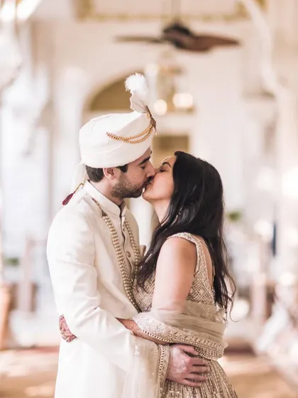 An intimate kiss shared between the bride and groom. A timeless and romantic shot that every couple cherishes from their big day.