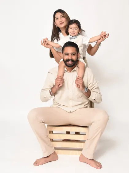 A fun and playful family pose. Having your child on your shoulders always brings out the biggest smiles from everyone.