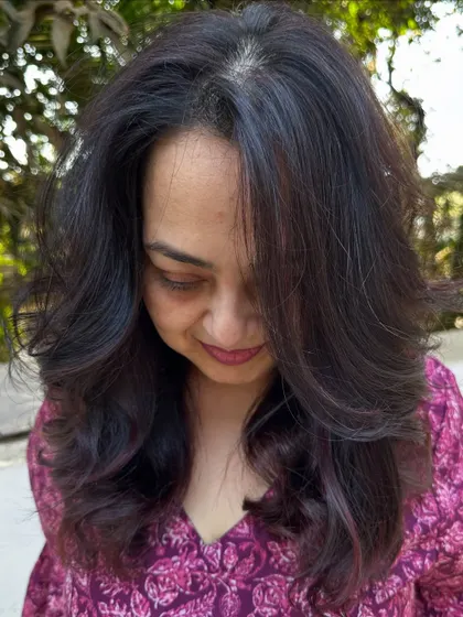 A portrait of the client with her new hair color.