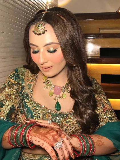 A final shot showing the intricate mehendi design on her hands.