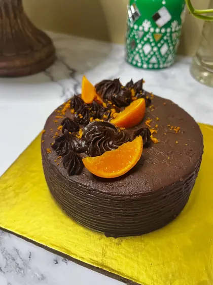 This dark chocolate cake is infused with the bright, zesty warmth of orange. It's a classic flavor combination that is both comforting and sophisticated, perfect for an evening treat.
