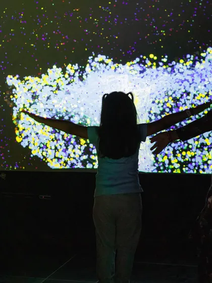 A silhouette against a galaxy of stars on our interactive wall. The visual possibilities are endless.