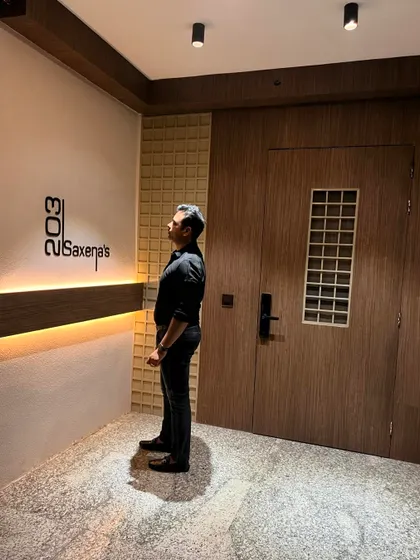 Another view of the transformed main entrance, showing the warm glow of the integrated lighting.
