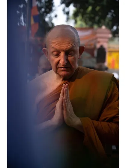 A senior monk with his hands joined in prayer, his face showing deep concentration. I framed this shot to create a candid portrait that speaks to a lifetime of devotion and spiritual practice.
