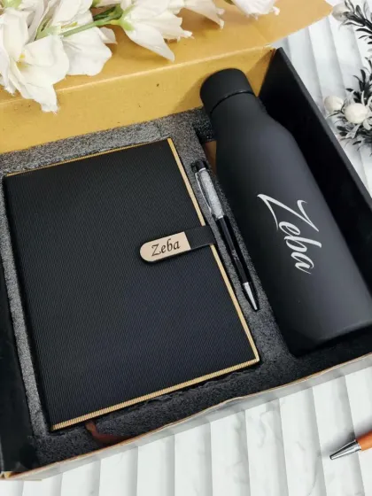 A sleek and professional gift set featuring a carbon-fiber textured diary with a wooden nameplate and a matte black temperature bottle. This is an excellent choice for corporate gifting or for a colleague.