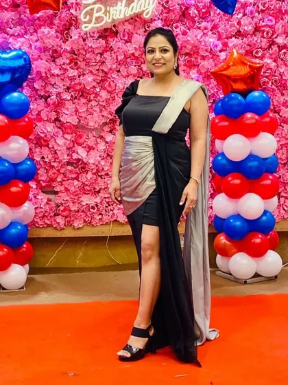 Another shot of my client shining in her custom black and silver gown. The thigh-high slit adds a touch of modern glamour to the elegant design.