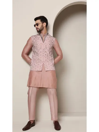 The 'Mystic Rose' bandi set, styled with sunglasses for a cool, contemporary edge. The rose copper hue is a unique choice for men's ethnic wear, designed for those who want to stand out.