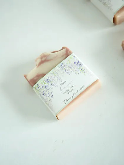 A single, beautifully wrapped soap favor, highlighting the personalized touch for the baby shower.