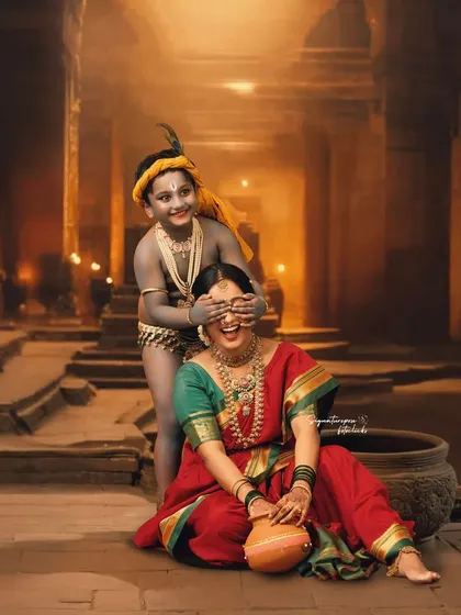 A playful peek-a-boo moment that perfectly captures the mischievous spirit of Lord Krishna and the loving patience of his mother, Yashoda.