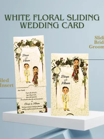 This white floral sliding wedding card features a cute bride and groom caricature that moves as you pull the insert. It's a fun and interactive way to invite your guests.