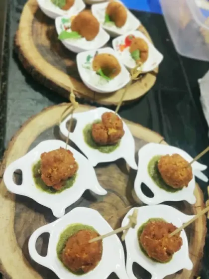 A platter of assorted fried starters served with green chutney. These are perfect for cocktail parties and as passed appetizers.