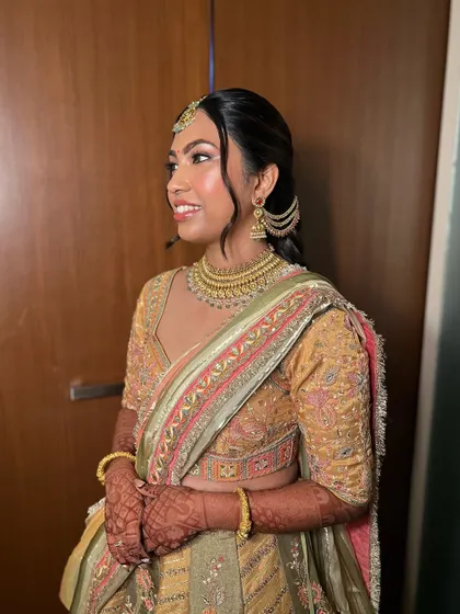 My stunning bride Pari from Dubai, glowing for her Sangeet night. We chose a warm, golden look to complement her multi colored lehenga.