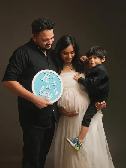The whole family joins in for the big news. Including their older son in the gender reveal makes the moment even more special and creates a beautiful family memory.