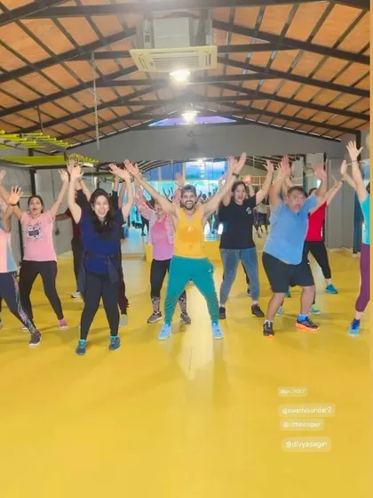 Another action shot from our vibrant yellow-floor studio. The bright environment adds to the energetic atmosphere.