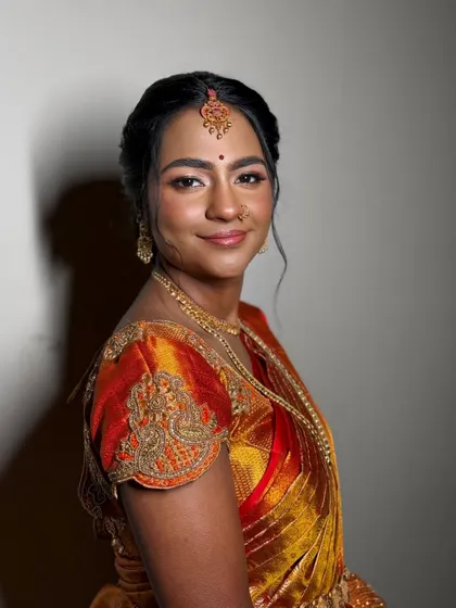 The joy of a bride on her special day is my greatest inspiration. For this traditional South Indian ceremony, I created a warm, glowing look with a dewy base and defined eyes to complement her vibrant Kanjeevaram saree and temple jewellery.
