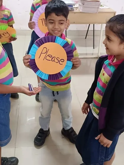 A cheerful interaction where students learn to use the word 'Please' when making a request.