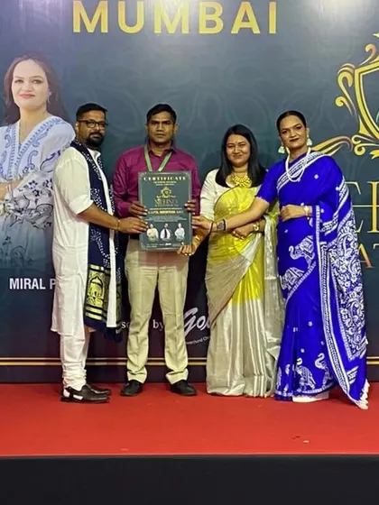 On stage in Mumbai, receiving recognition for my participation in a mehndi competition. Continuous learning is key in our art.