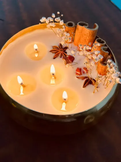 A beautiful shot of the 6-inch scented urli candle, topped with fragrant spices and dried flowers. A very aesthetic decor piece.