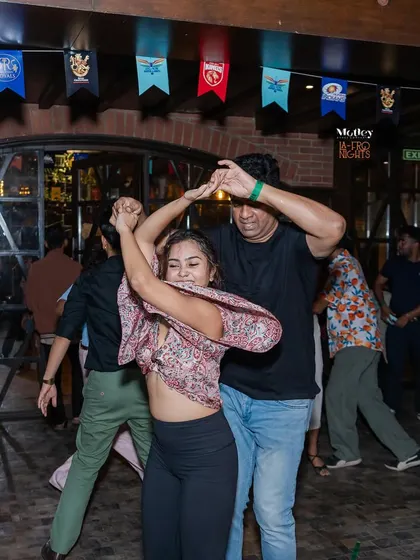 A candid shot from our La-Fro Nights social. This is where you put what you learn in class into practice, in a real, fun, and supportive party environment.