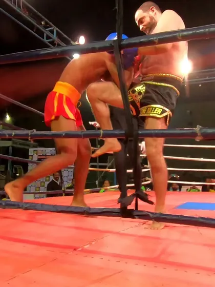 Controlling the fight against the ropes. Our fighter uses his strength and technique to wear down his opponent.