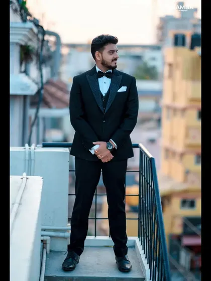 A duplicate of 315, a stylish groom portrait against a city backdrop.