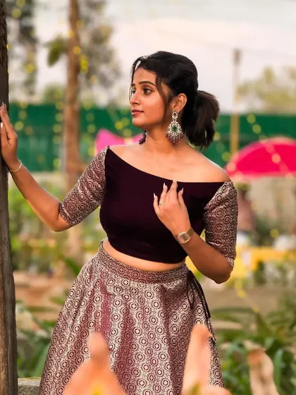 A beautiful portrait of a client in the purple off-shoulder outfit, perfect for capturing memories of a special night.