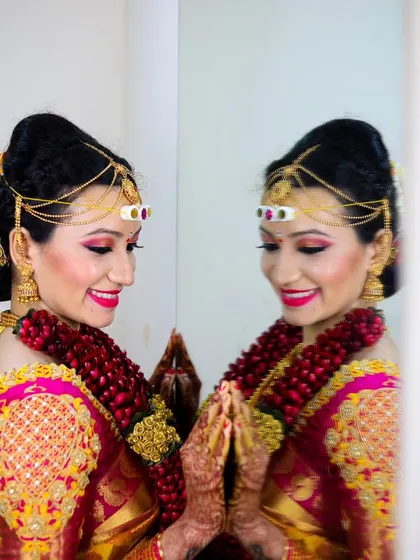 An artistic bridal portrait using a mirror to create a beautiful reflection.