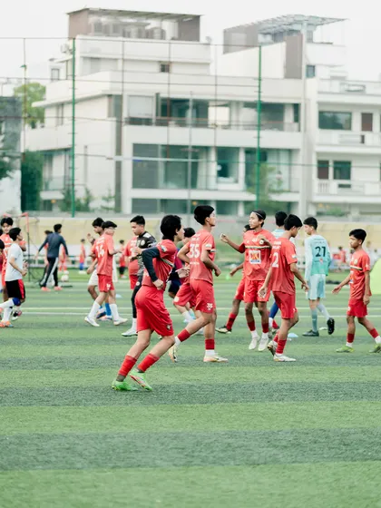 An action-packed training game in progress. These small-sided games increase touches on the ball and improve decision-making in tight spaces.